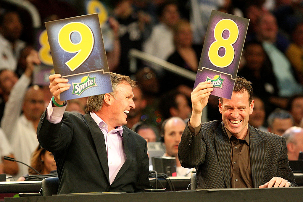 Tom Chambers and Dan Majerle hold up scores during the Sprite Slam Dunk Contest during the 2009 NBA All-Star Weekend.