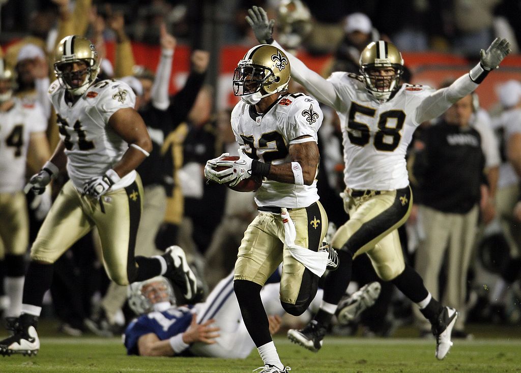 Tracy Porter of the New Orleans Saints intercepts a ball thrown by Peyton Manning and returns it for a touchdown.