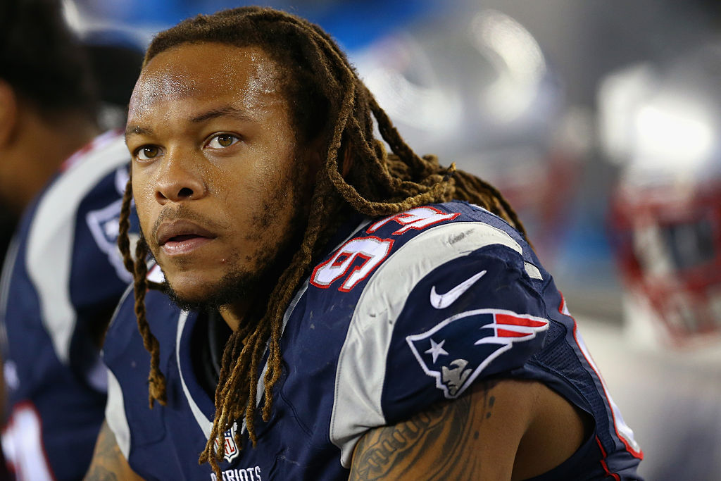 Jabaal Sheard of the New England Patriots looks on from the bench during a game.