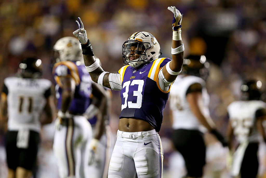 Jamal Adams of the LSU Tigers raises his arms in the air after a touchdown.