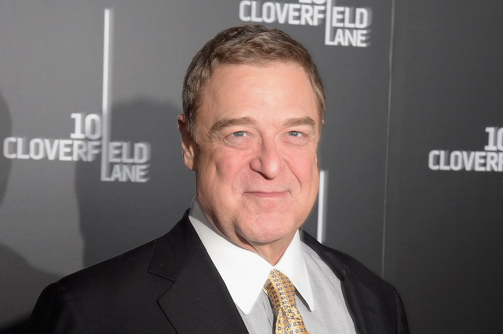 Actor John Goodman appears on the red carpet at a movie premiere.