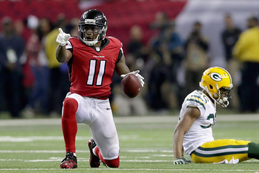 The Atlanta Falcons' Julio Jones points as his competition after a great play.