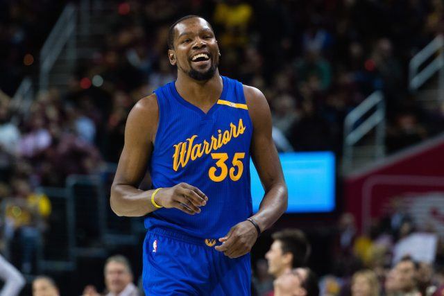 Kevin Durant laughs before a game.