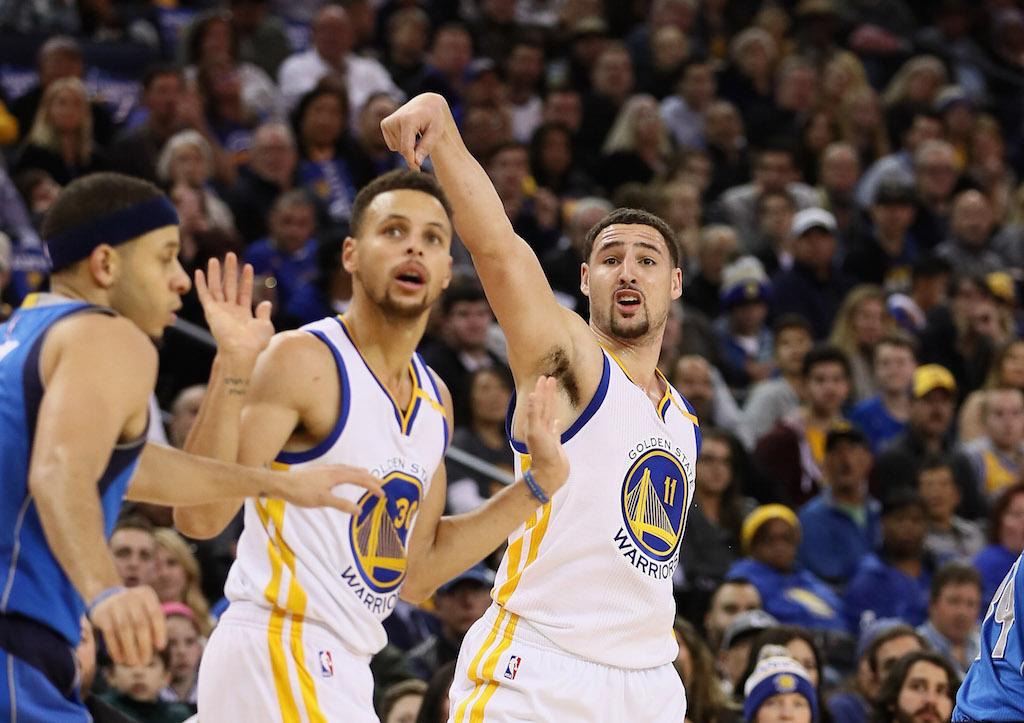 Stephen Curry and Klay Thompson argue a foul.