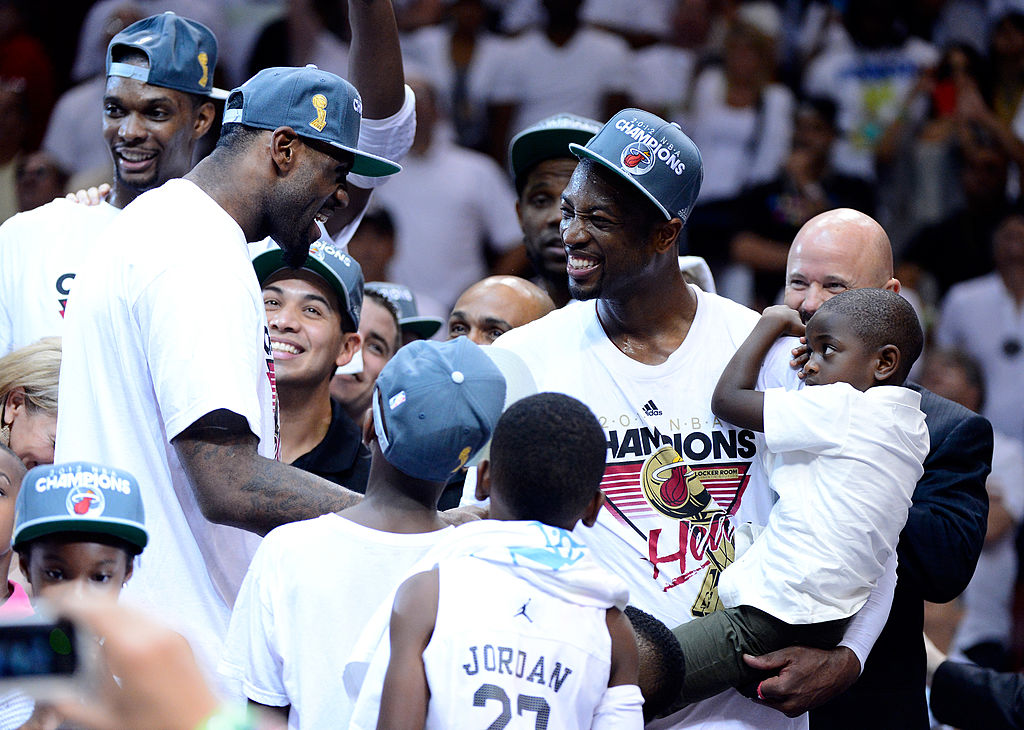 LeBron James and Dwyane Wade of the Miami Heat celebrate with family after they won the 2012 NBA Finals.