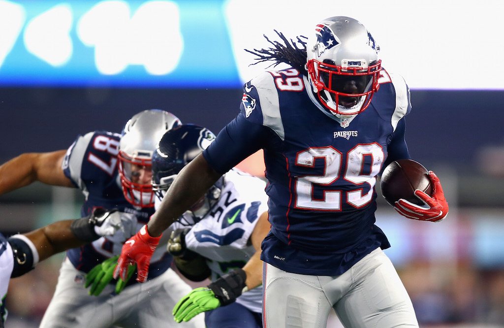 LeGarrette Blount grips the ball and runs with purpose.