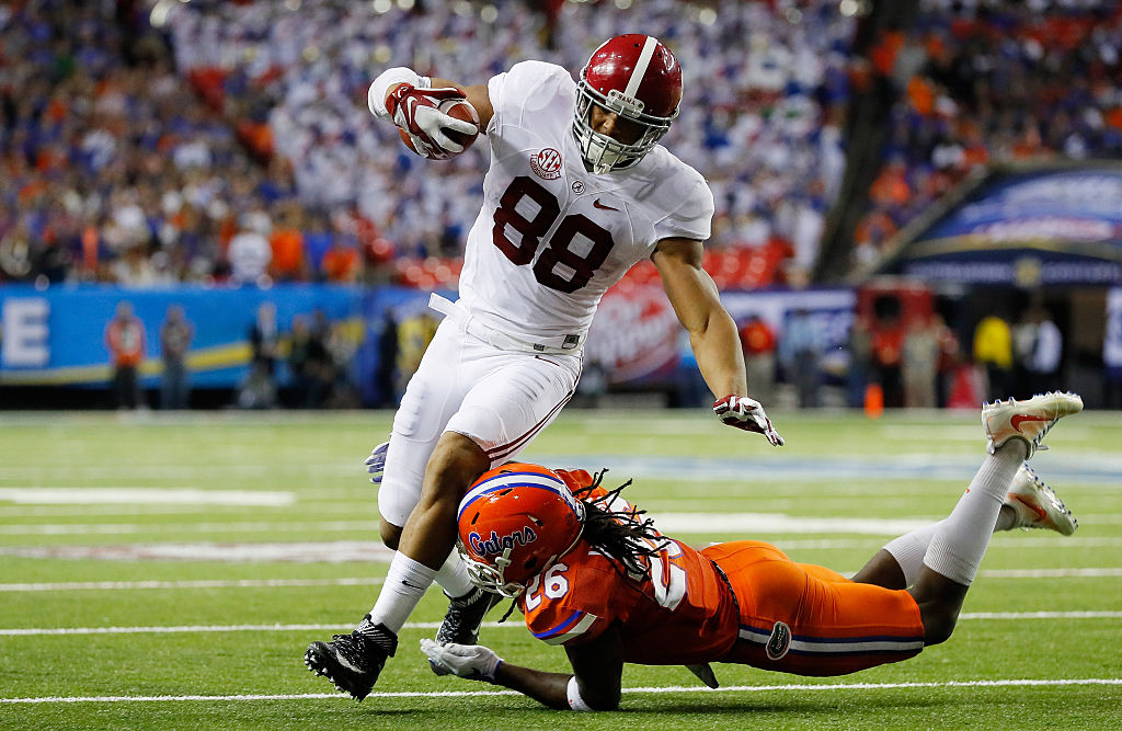 Marcell Harris #26 of the Florida Gators tackles O.J. Howard #88 of the Alabama Crimson Tide