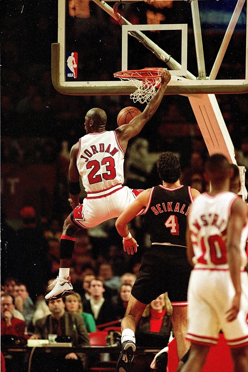 Michael Jordan of the Chicago Bulls dunks the ball.