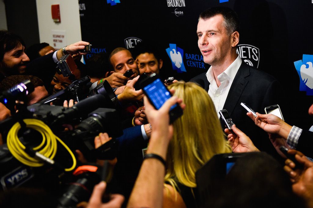 Mikhail Prokhorov speaks to the media after a game.