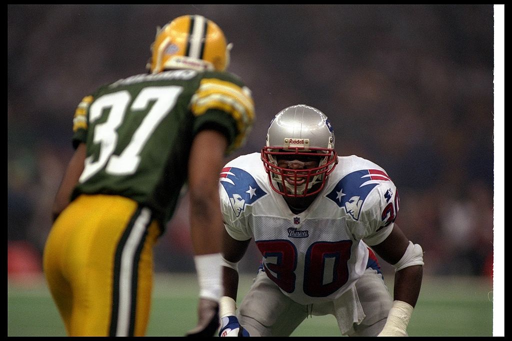 Defensive back Corwin Brown of the New England Patriots faces off against a member of the Green Bay Packers.