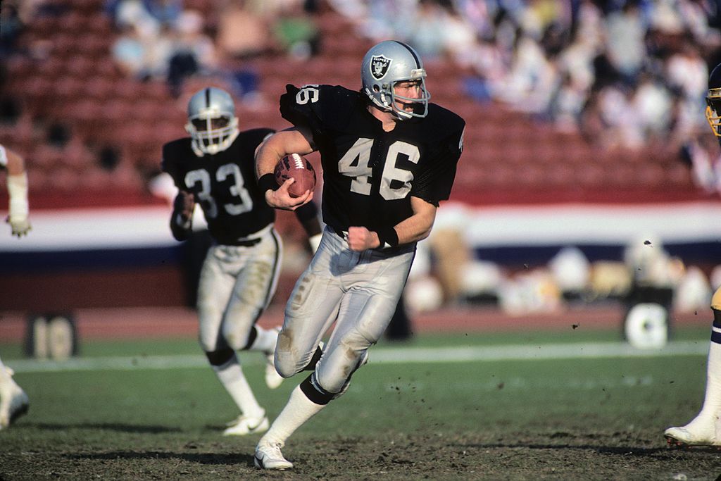 Todd Christensen of the Los Angeles Raiders runs the ball.