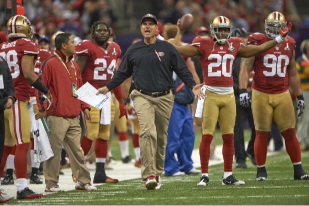 San Francisco 49ers head coach Jim Harbaugh argues a call.