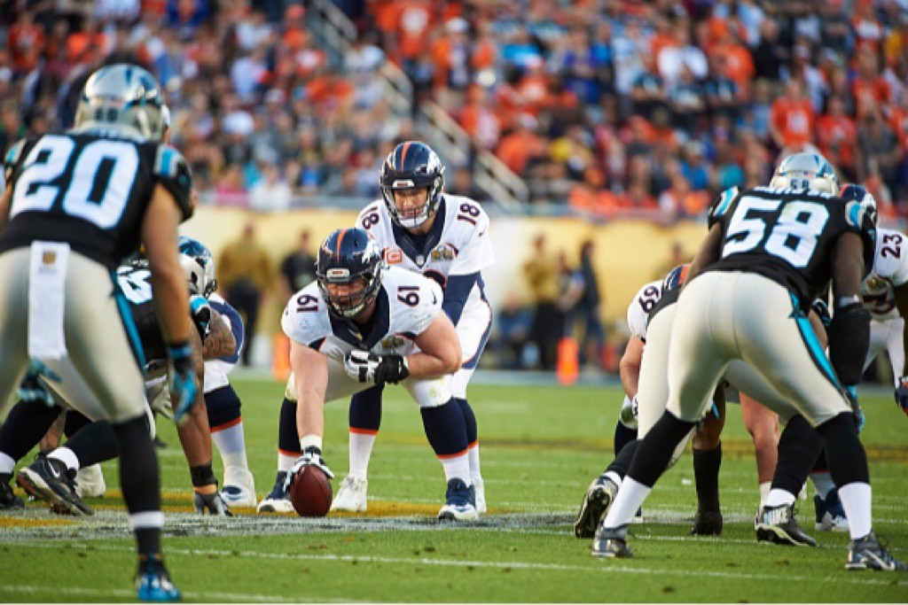 Denver Broncos QB Peyton Manning prepares at the line of scrimmage.