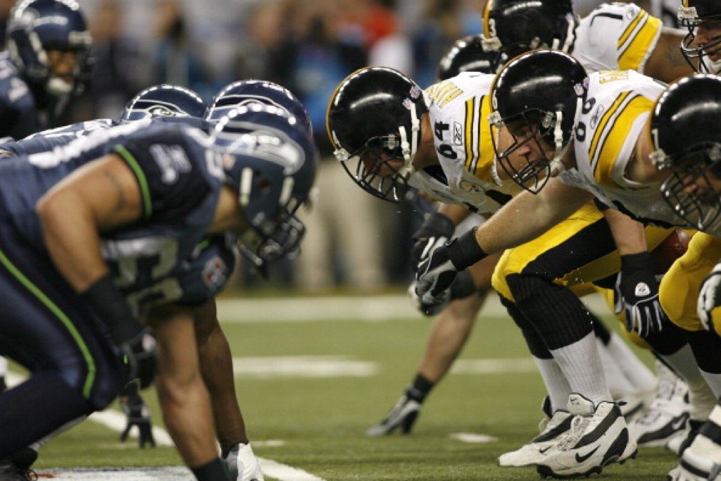 The Pittsburgh Steelers defensive line prepares for battle during Super Bowl XL.