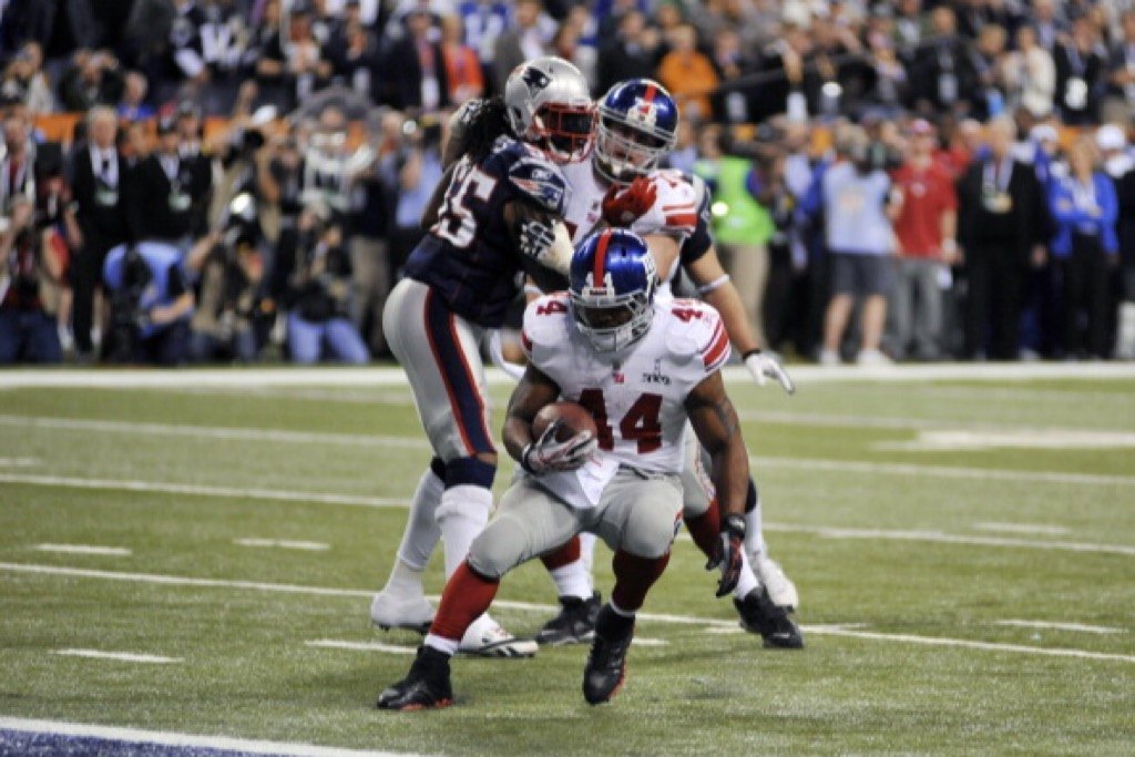 Ahmad Bradshaw of the New York Giants carries the ball against the New England Patriots.