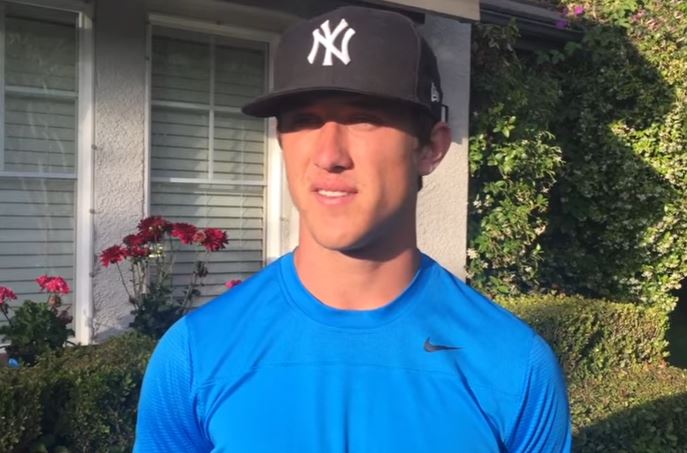 One of the top New York Yankees prospects, Blake Rutherford, wears his team hat during an interview.