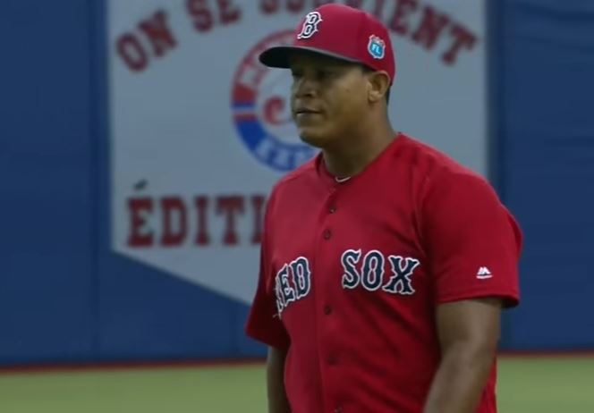 Luis Ysla on the field in his Boston Red Sox uniform.