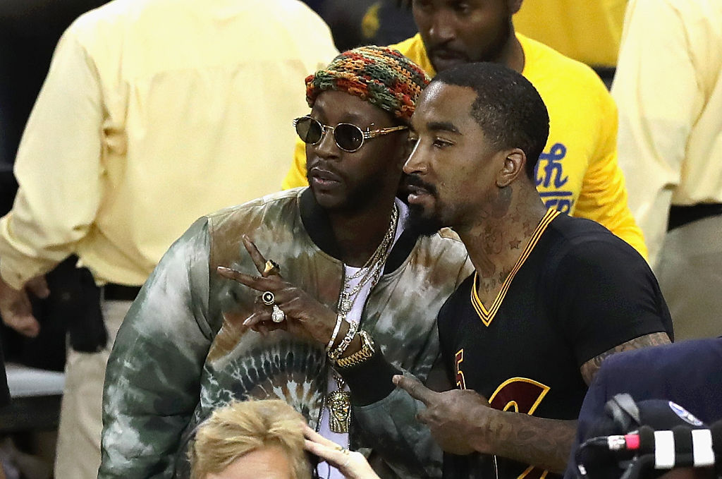 J.R. Smith of the Cleveland Cavaliers poses with rapper 2 Chainz.