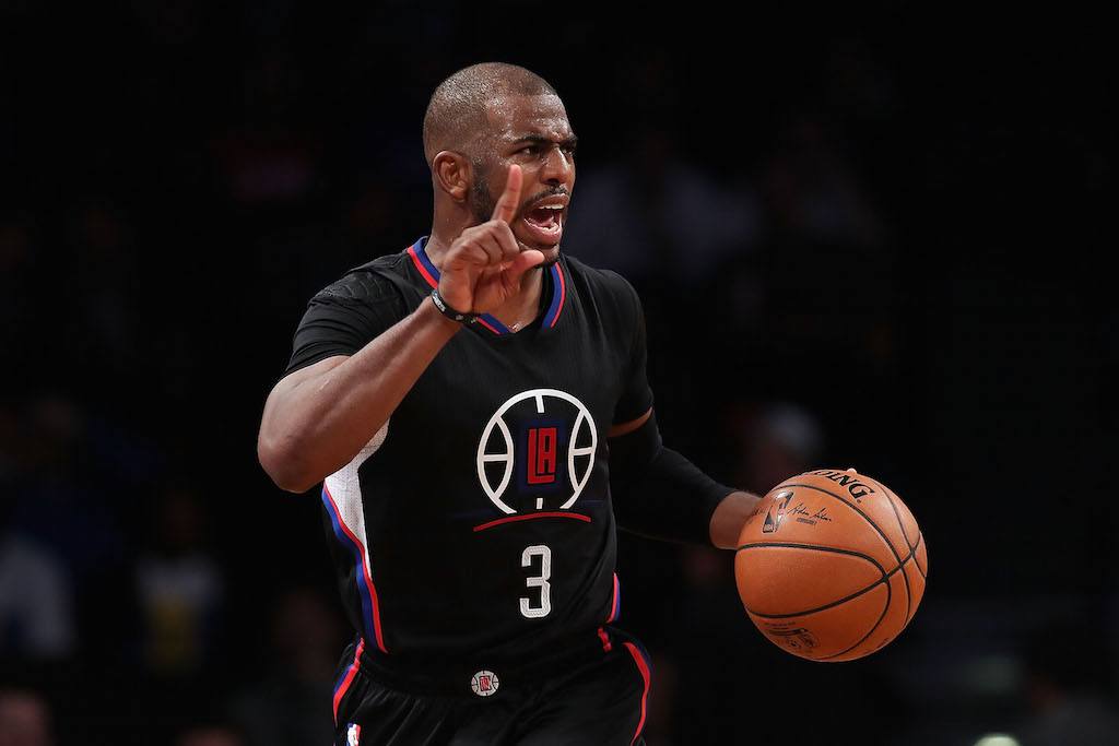 Chris Paul points and yells to his teammates.
