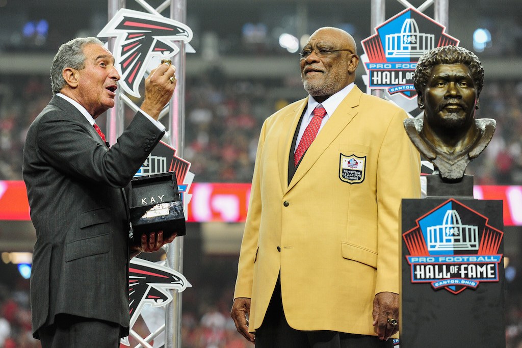 Claude Humphrey stands on stage as he's inducted into the Hall of Fame.