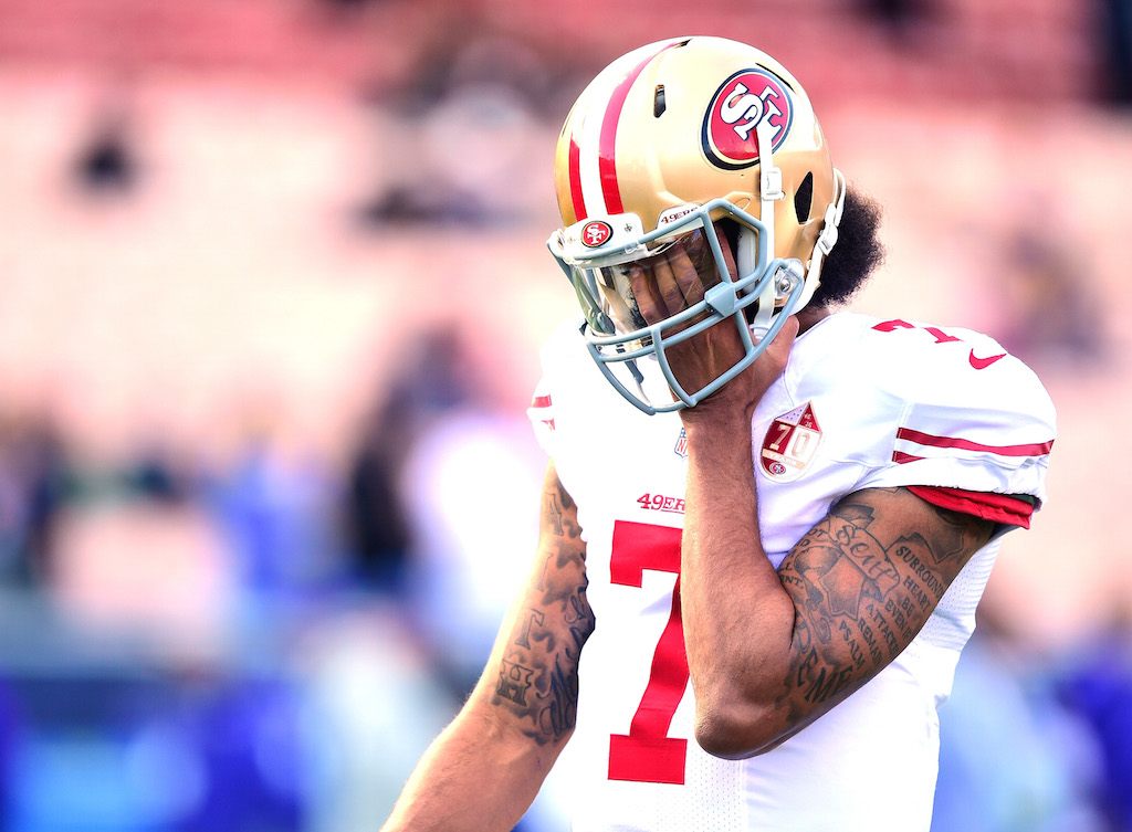 Colin Kaepernick looks frustrated during warmups with his former team.