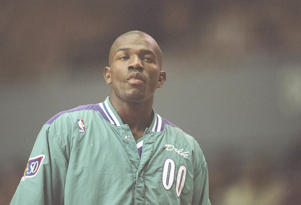 Guard Tony Delk of the Charlotte Hornets stands on the court before a game against the Los Angeles Clippers.