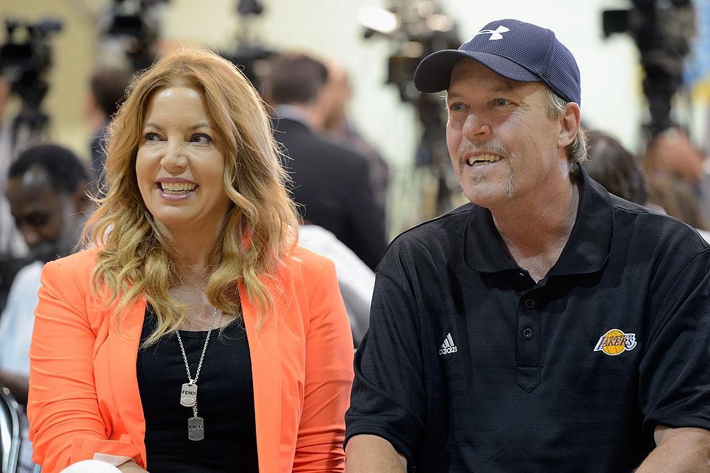Jim Buss and his sister Jeanie Buss of the Los Angeles lakers attend a news conference.