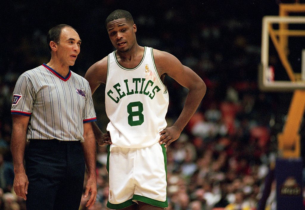 Antoine Walker of the Boston Celtics talks to a referee.