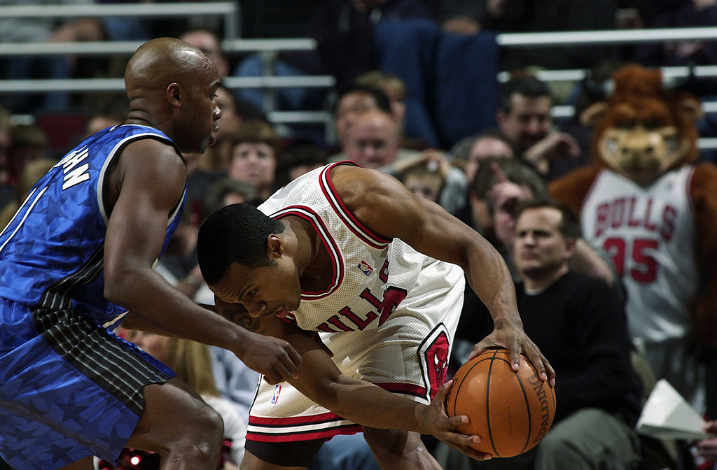 Jay Williams of the Chicago Bulls is defended by Jacque Vaughn of the Orlando Magic.