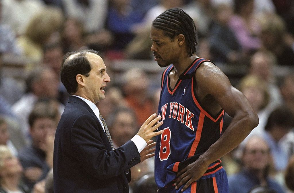 Latrell Sprewell of the New York Knicks listens to head coach Jeff Van Gundy.