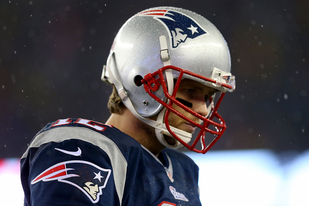 Tom Brady of the New England Patriots looks on as he prepares to win yet another playoff game.