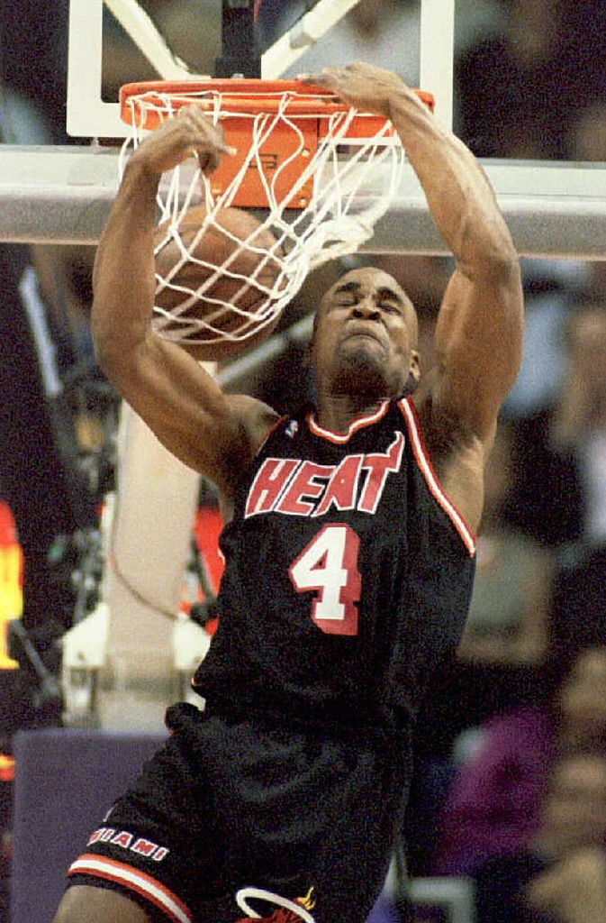 Using what he calls his "double-pump reverse," Harold Miner of the Miami Heat dunks the ball.