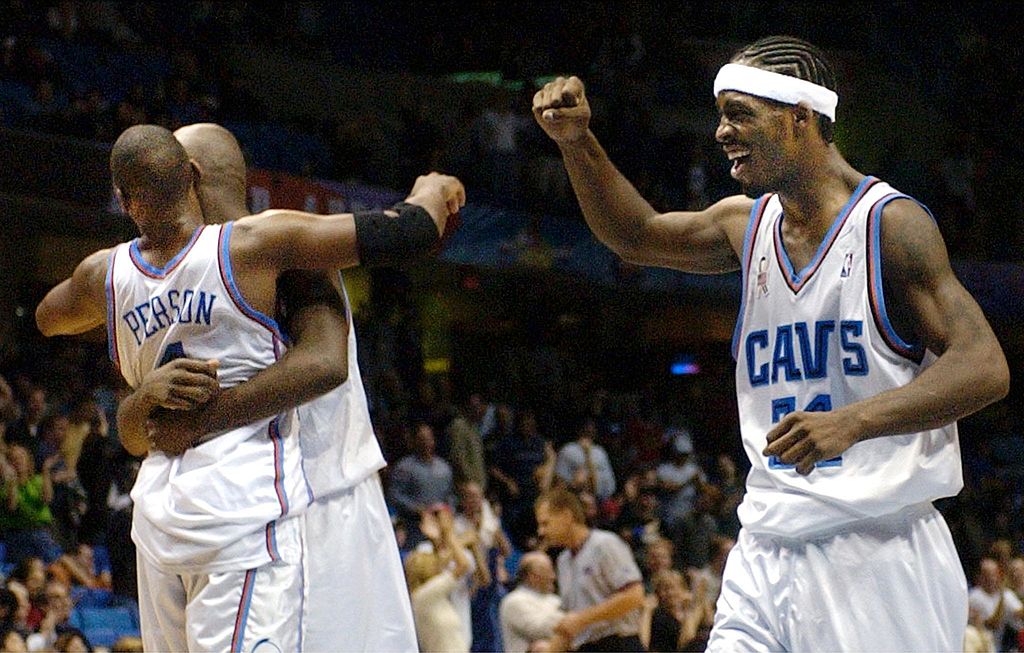 Ricky Davis and his teammates celebrate an overtime victory.