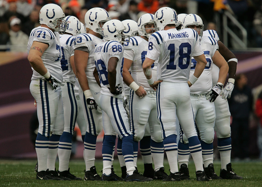 Quarterback Peyton Manning of the Indianapolis Colts leads a huddle while facing the Chicago Bears