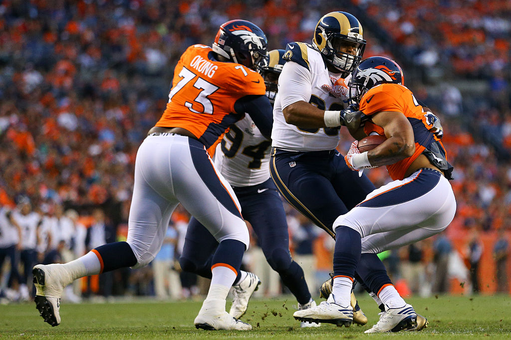 Russell Okung makes a block | Justin Edmonds/Getty Images