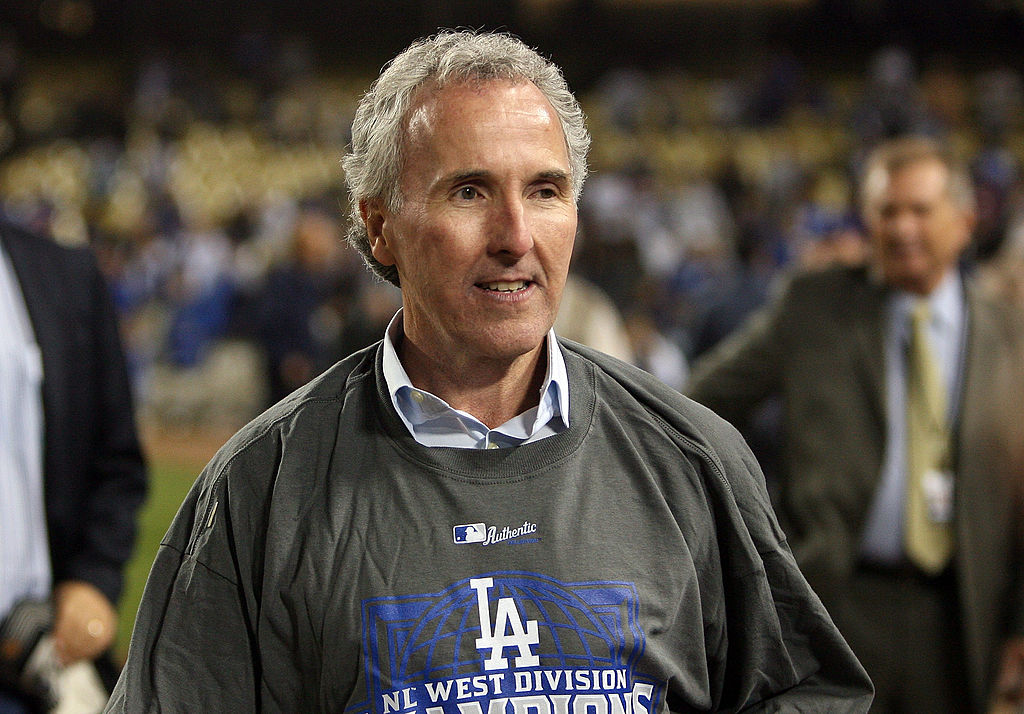 Owner Frank McCourt celebrates after winning the National League West against the Colorado Rockies in 2009.