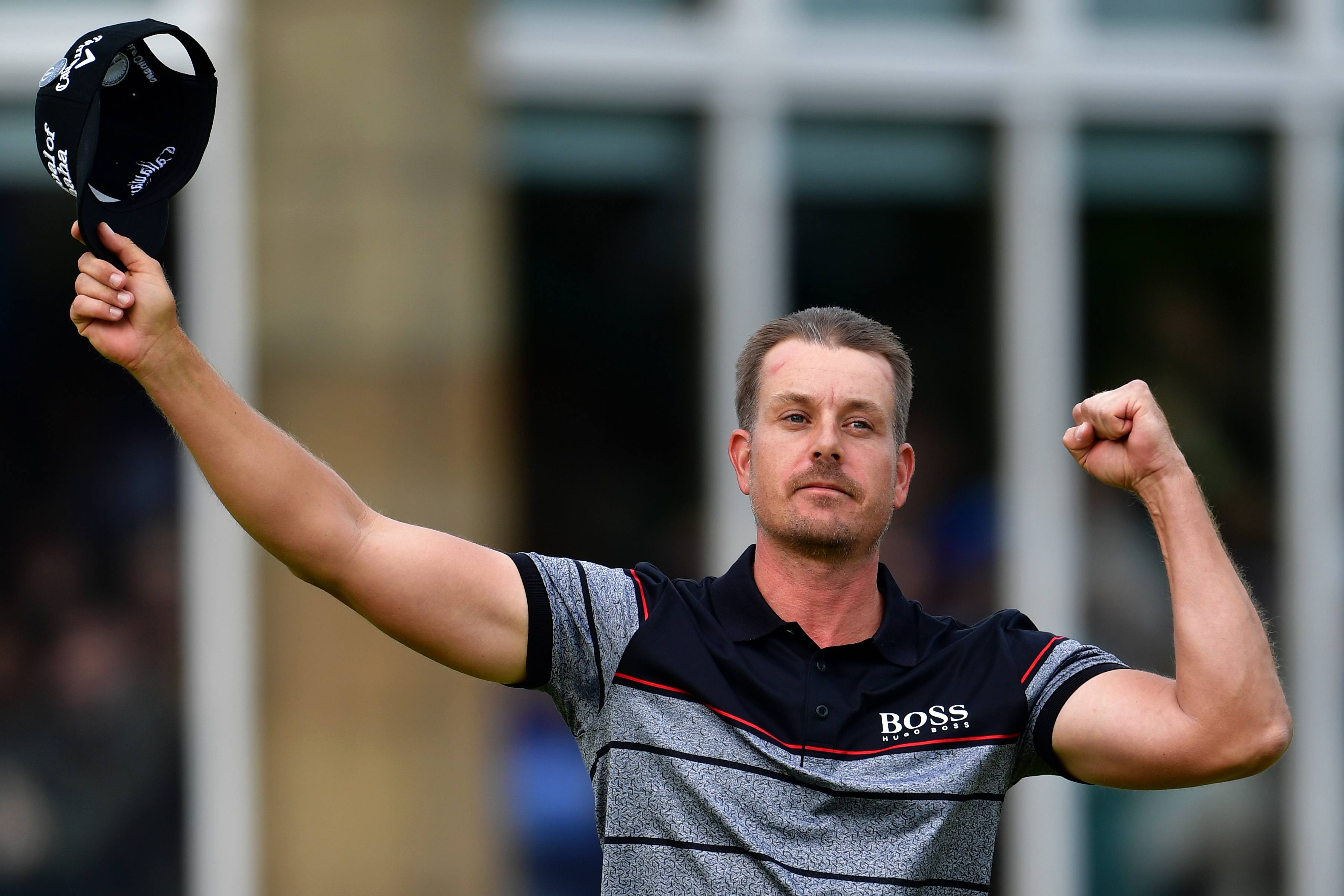 Henrik Stenson waves his hat at the crowd.