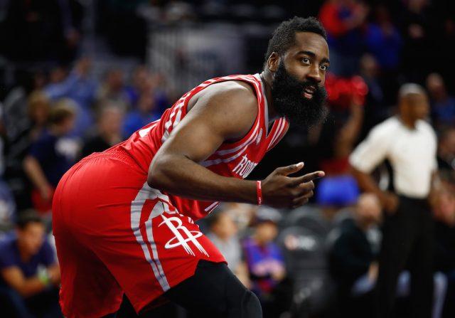 James Harden gestures to his teammates.