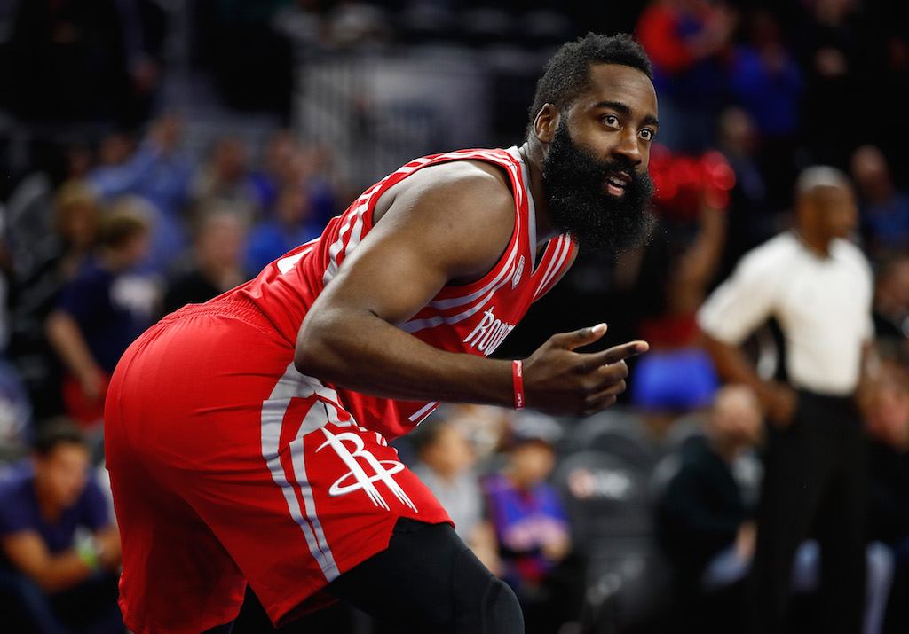 James Harden gestures to his teammates.