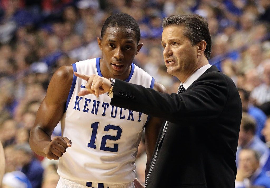John Calipari instructs one of his players during the action.