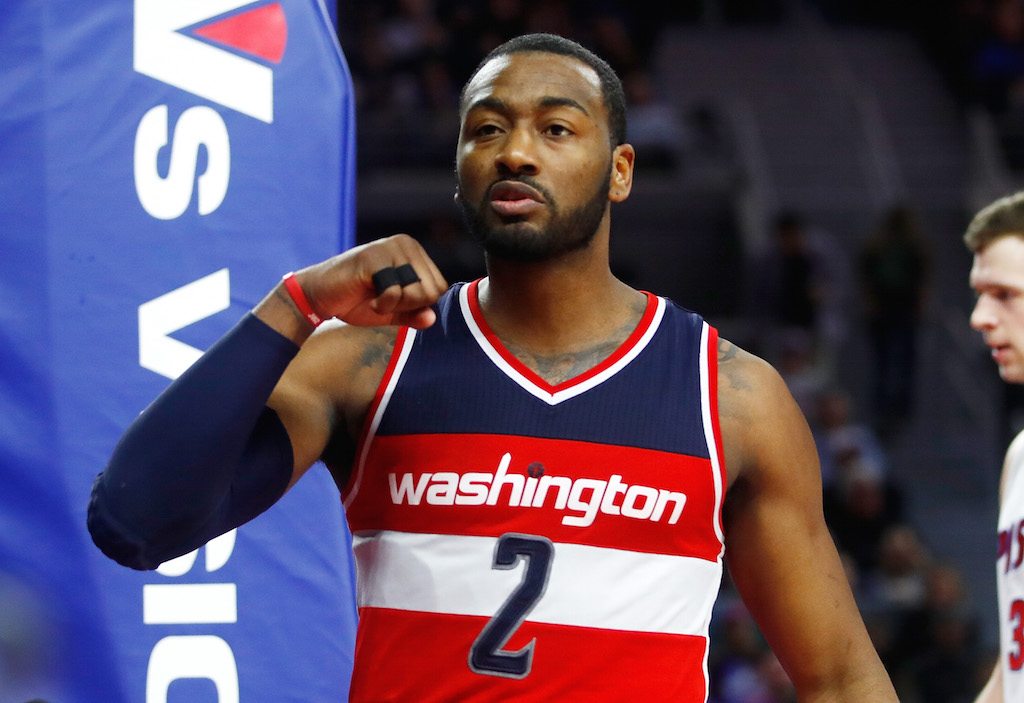 John Wall walks across the court during a timeout.