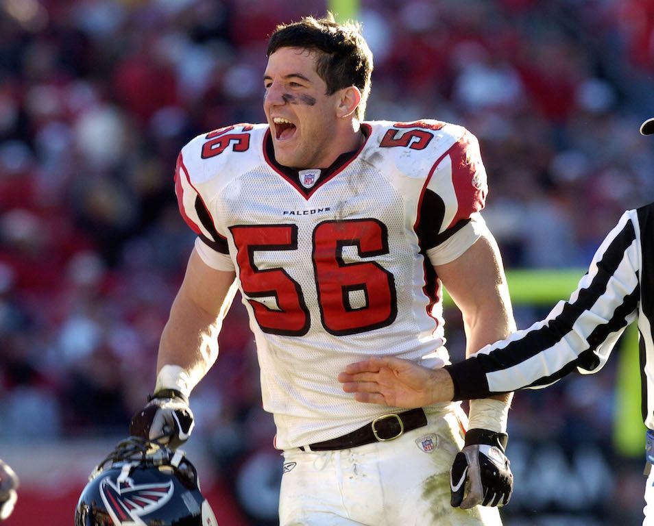 Keith Brooking cheers after winning a game.