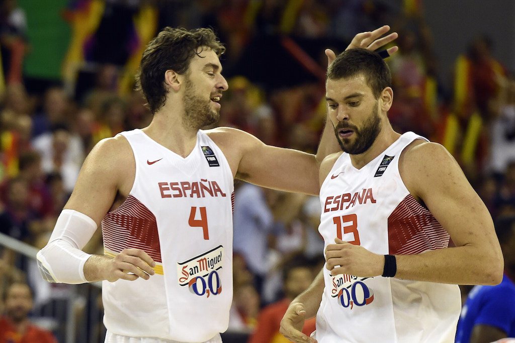 The Gasol brothers celebrate during a game for Spain.