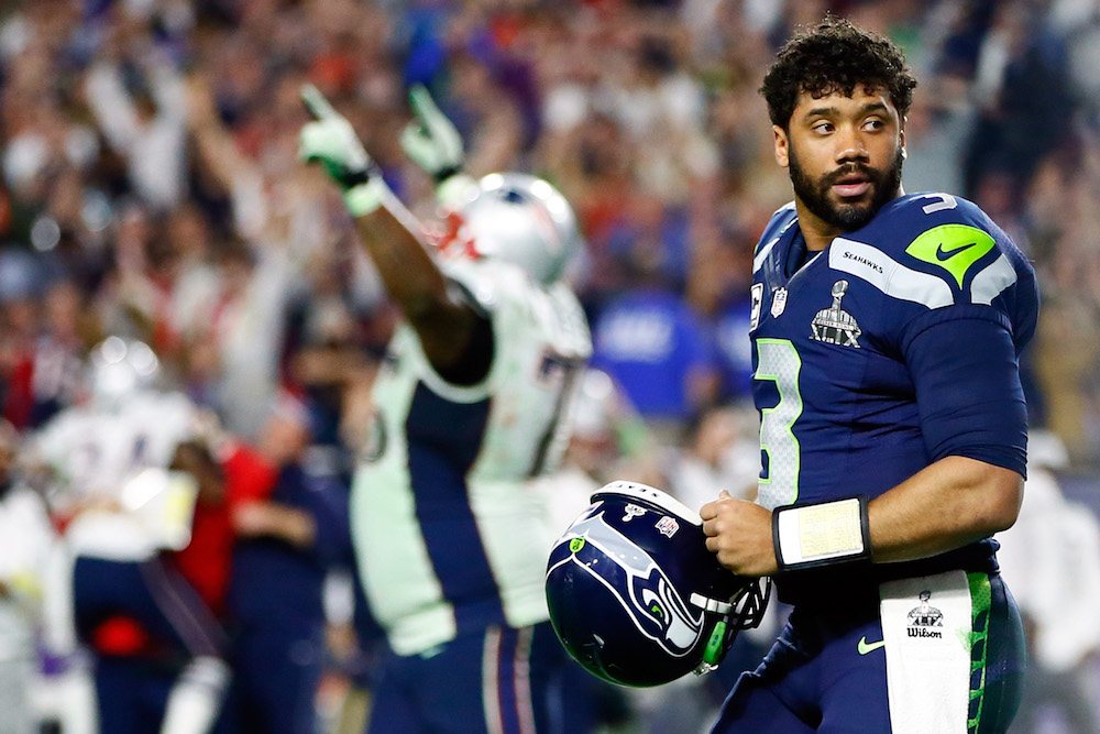 Russell Wilson looking on after a play Russell Wilson looking on after a play