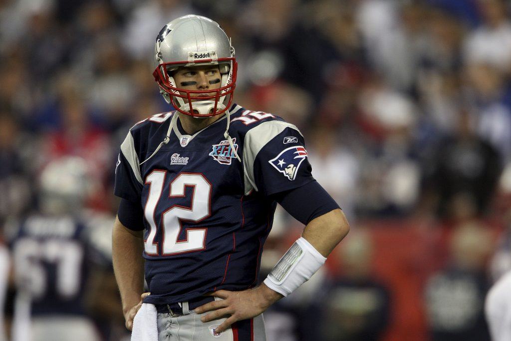GLENDALE, AZ - FEBRUARY 03: Quarterback Tom Brady #12 of the New England Patriots looks on during Super Bowl XLII against the New York Giants on February 3, 2008 at the University of Phoenix Stadium in Glendale, Arizona. The Giants defeated the Patriots 17-14. (Photo by Andy Lyons/Getty Images)