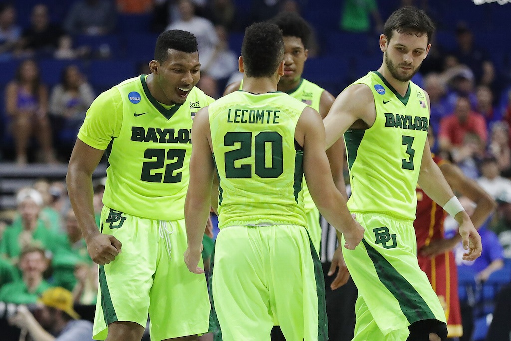 King McClure #22 of the Baylor Bears celebrates with his teammates.