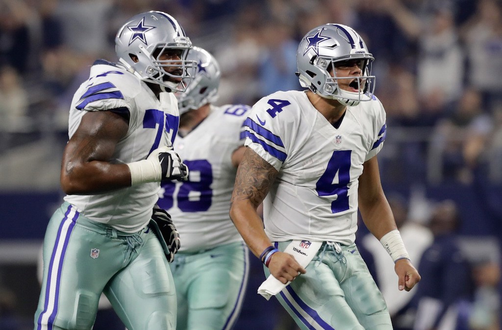 Dak Prescott celebrates after throwing a touchdown pass.