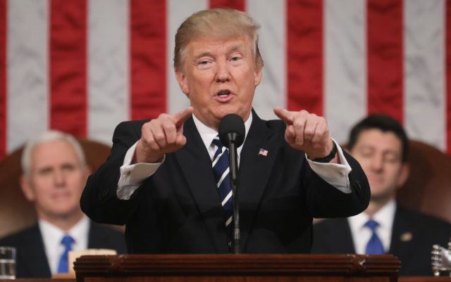 U.S. President Donald J. Trump (C) delivers his first address to a joint session of the U.S. Congress