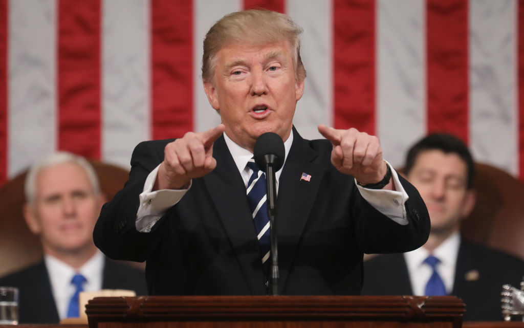 U.S. President Donald J. Trump (C) delivers his first address to a joint session of the U.S. Congress