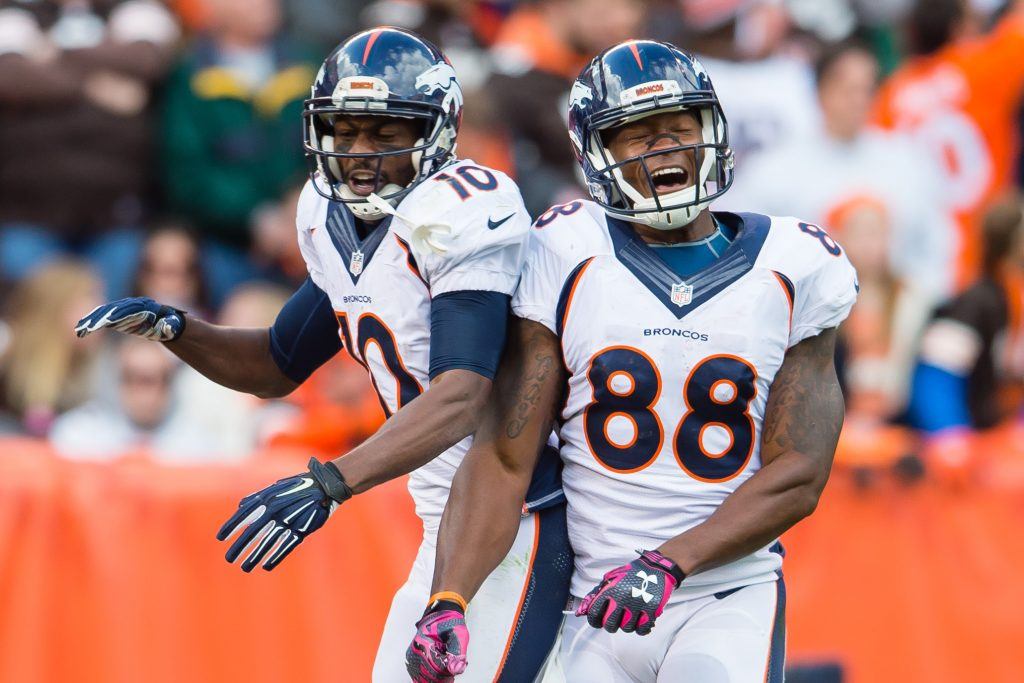 Emmanuel Sanders and Demaryius Thomas celebrate a win.